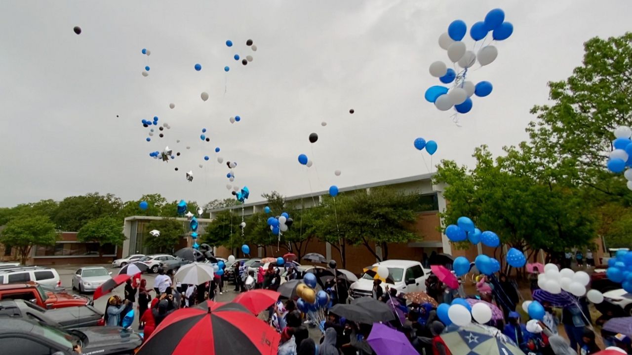 Pictured are the hundred-plus people who attended a balloon release ceremony remembering 11-year-old Dazmon Ray Brown Jr. who was shot and killed in what’s believed to be an accident by a 9-year-old friend. (Lupe Zapata/Spectrum News 1)